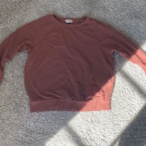 red-ish crewneck sweatshirt